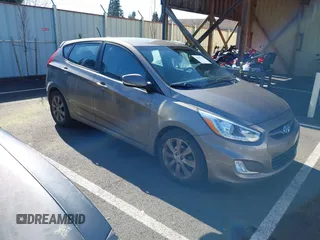 2014 Hyundai Accent SE with VIN KMHCU5AE3EU150981, listed as a IAAI auction lot 41693118 with 128,712 mi miles. Bid and sale history available at carsss.com. Image 1.