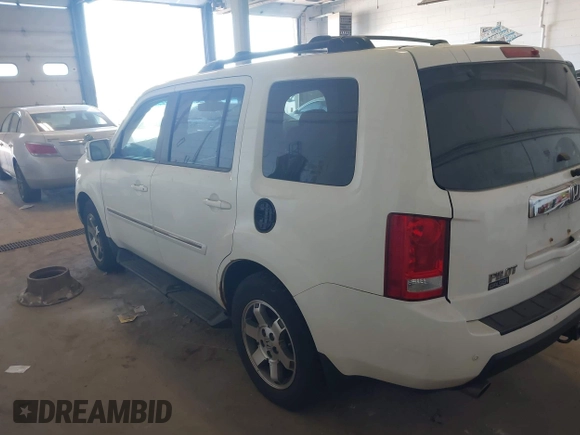 2010 Honda Pilot Touring with VIN 5FNYF4H95AB019903, listed as a IAAI auction lot 42196082 with 233,527 mi miles and . Bid and sale history available at carsss.com. Image 3.