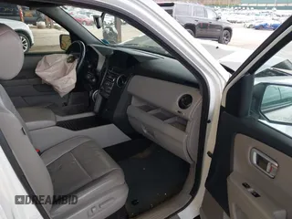 2014 Honda Pilot EX-L with VIN 5FNYF4H59EB047609, listed as a IAAI auction lot 42071353 with 148,661 mi miles and . Bid and sale history available at carsss.com. Image 5.