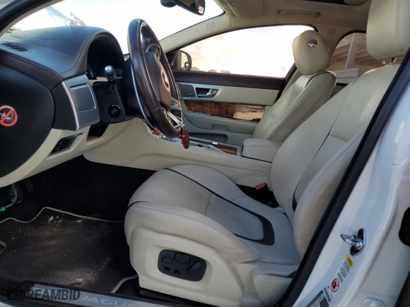 2015 Jaguar XF V6 Portfolio with VIN SAJWA0F74F8U57935, listed as a Copart auction lot 80248064 with 137,404 mi miles and Salvage Title. Bid and sale history available at carsss.com. Image 7.