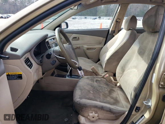2009 Kia Rio LX with VIN KNADE223296470687, listed as a Copart auction lot 48385925 with 176,400 mi miles and Salvage Title. Bid and sale history available at DreamBid. Image 7.