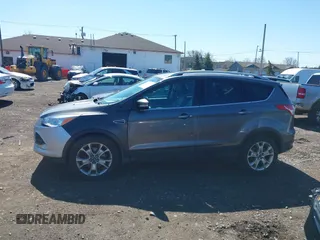 2014 Ford Escape Titanium with VIN 1FMCU9JX1EUB94776, listed as a IAAI auction lot 42063678 with 138,036 mi miles. Bid and sale history available at carsss.com. Image 14.
