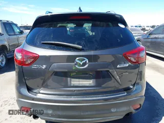 2016 Mazda CX-5 Grand Touring with VIN JM3KE2DY9G0824196, listed as a IAAI auction lot 41801887 with 88,625 mi miles. Bid and sale history available at carsss.com. Image 17.