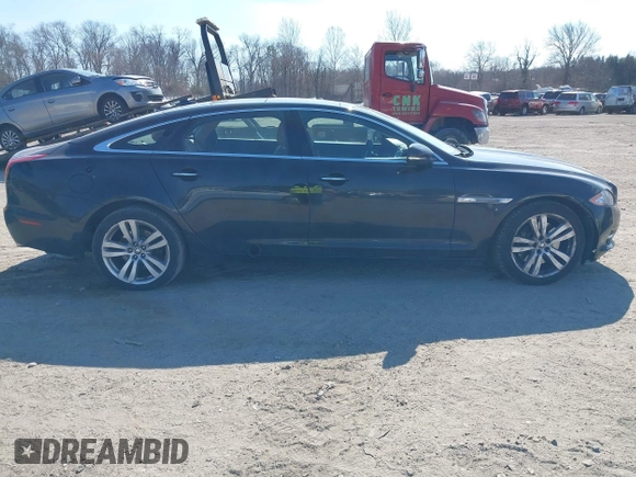 2013 Jaguar XJ Portfolio with VIN SAJWJ2GDXD8V55879, listed as a IAAI auction lot 41568366 with 121,119 mi miles and . Bid and sale history available at DreamBid. Image 13.
