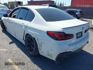 2023 BMW 5 Series 530e with VIN WBA13AG09PCM41820, listed as a IAAI auction lot 42409541 with 17,715 mi miles and . Bid and sale history available at DreamBid. Image 3.