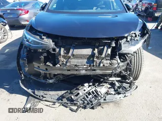 2023 Volkswagen ID.4 Pro z VIN 1V2DNPE85PC028748, wystawiony jako IAAI lot #41348983 z przebiegiem 7 434 mil mil oraz . Historia ofert i sprzedaży dostępna na DreamBid. Obrazek 6.