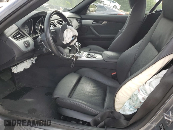 2011 BMW Z4 sDrive35is with VIN WBALM1C50BE633213, listed as a Copart auction lot 61220135 with 62,458 mi miles and Salvage title. Bid and sale history available at DreamBid. Image 7.