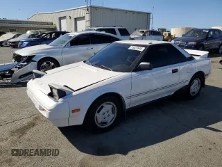 1986 Toyota MR2 z VIN JT2AW15CXG0080034, wystawiony jako Copart lot #73423944 z przebiegiem 54 316 mil mil oraz Szkody całkowita. Historia ofert i sprzedaży dostępna na DreamBid. Obrazek 1.