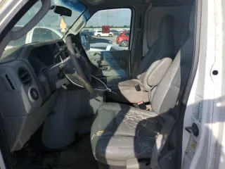 2010 Ford Econoline Cargo Commercial with VIN 1FTNE1EW1ADA07205, listed as a Copart auction lot 55904025 with 309,958 mi miles and Clean Title. Bid and sale history available at DreamBid. Image 7.