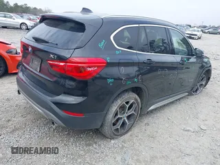2017 BMW X1 sDrive28i with VIN WBXHU7C36HP924874, listed as a IAAI auction lot 41368396 with 113,443 mi miles. Bid and sale history available at carsss.com. Image 4.