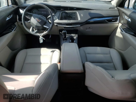 2023 Cadillac XT4 FWD Luxury with VIN 1GYAZAR46PF134602, listed as a Copart auction lot 54684865 with 13,221 mi miles and Salvage title. Bid and sale history available at DreamBid. Image 8.