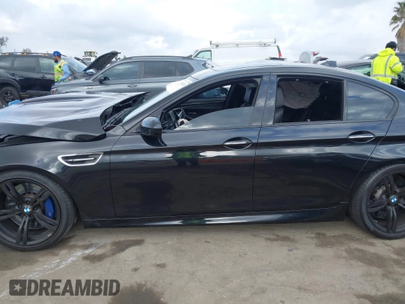 2016 BMW M5 z VIN WBSFV9C54GD595793, wystawiony jako IAAI lot #42101121 z przebiegiem 58 775 mil mil oraz . Historia ofert i sprzedaży dostępna na DreamBid. Obrazek 13.