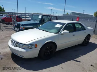 2003 Cadillac Seville Touring STS with VIN 1G6KY54963U110607, listed as a IAAI auction lot 42080691 with 79,605 mi miles. Bid and sale history available at carsss.com. Image 2.
