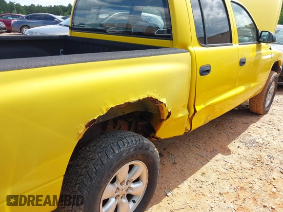 2004 Dodge Dakota Sport z VIN 1D7HG38N14S752273, wystawiony jako IAAI lot #42311042 z przebiegiem 157 402 mil mil oraz . Historia ofert i sprzedaży dostępna na DreamBid. Obrazek 13.