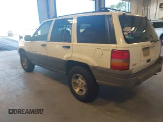 1997 Jeep Grand Cherokee Laredo with VIN 1J4GZ58SXVC552435, listed as a IAAI auction lot 41977888 with 143,832 mi miles. Bid and sale history available at carsss.com. Image 3.
