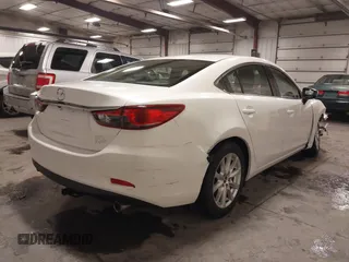 2016 Mazda Mazda6 i Sport with VIN JM1GJ1U54G1473671, listed as a IAAI auction lot 41576038 with 88,386 mi miles. Bid and sale history available at carsss.com. Image 4.