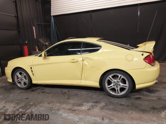 2006 Hyundai Tiburon GT z VIN KMHHN65F56U225936, wystawiony jako IAAI lot #41695280 z przebiegiem 121 110 mil mil oraz . Historia ofert i sprzedaży dostępna na DreamBid. Obrazek 14.
