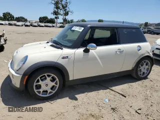 2005 MINI Hardtop S with VIN WMWRE33495TD95584, listed as a Copart auction lot 61571785 with 76,429 mi miles and Salvage title. Bid and sale history available at DreamBid. Image 1.