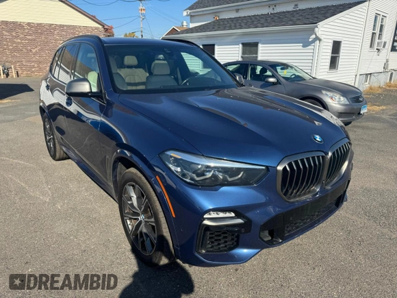 2021 BMW X5 M50i with VIN 5UXJU4C00M9H36466, listed as a Copart auction lot 77444344 with 100,119 mi miles and Clean Title. Bid and sale history available at carsss.com. Image 4.