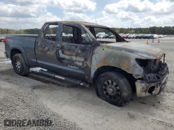 2010 Toyota Tundra с VIN 5TFUM5F15AX005061, выставлен на аукционе Copart как лот 51823565 с пробегом Не указан миль и Списание • Salvage title. История ставок и продаж доступна на DreamBid. Изображение 4.