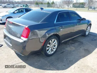 2016 Chrysler 300 Anniversary Edition with VIN 2C3CCARG7GH230414, listed as a IAAI auction lot 41853857 with 84,639 mi miles and . Bid and sale history available at DreamBid. Image 4.