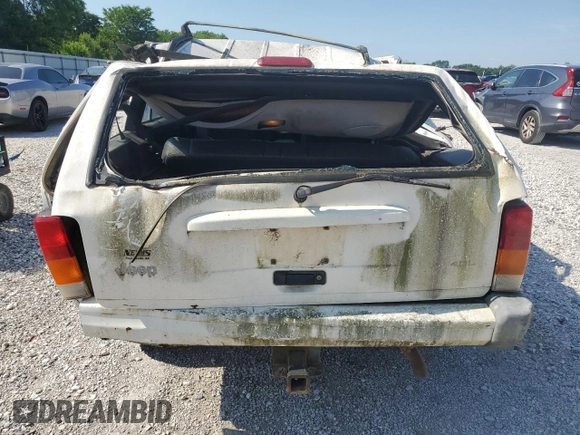 1999 Jeep Cherokee Sport z VIN 1J4FF68S3XL597049, wystawiony jako Copart lot #58736325 z przebiegiem 134 684 mil mil oraz Nie do naprawy • Non repairable. Historia ofert i sprzedaży dostępna na DreamBid. Obrazek 6.