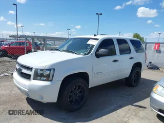2007 Chevrolet Tahoe LS with VIN 1GNFC13C77J404051, listed as a IAAI auction lot 42093772 with 213,729 mi miles and . Bid and sale history available at DreamBid. Image 2.