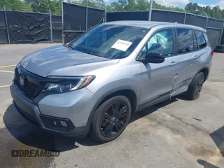 2021 Honda Passport Sport with VIN 5FNYF7H27MB003467, listed as a IAAI auction lot 42183219 with 52,156 mi miles and . Bid and sale history available at DreamBid. Image 2.