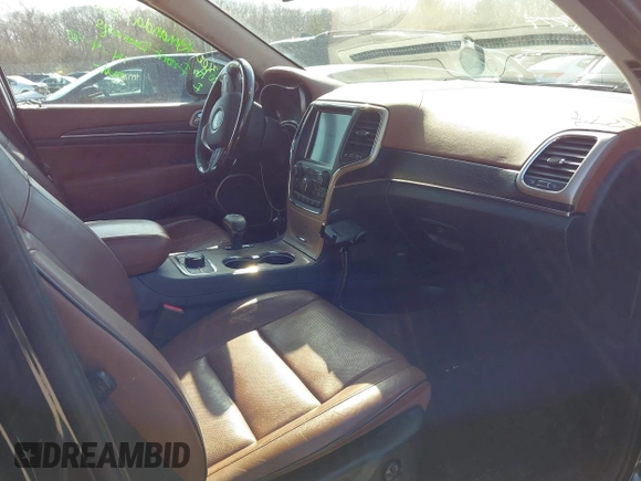 2015 Jeep Grand Cherokee Summit with VIN 1C4RJFJGXFC882787, listed as a IAAI auction lot 42098274 with 147,020 mi miles and . Bid and sale history available at DreamBid. Image 5.