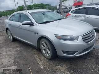 2014 Ford Taurus SEL with VIN 1FAHP2H8XEG161271, listed as a IAAI auction lot 42105228 with 140,256 mi miles. Bid and sale history available at carsss.com. Image 1.