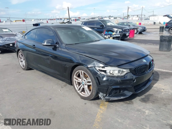 2014 BMW 4 Series 428i with VIN WBA3N7C55EF719504, listed as a IAAI auction lot 41403957 with 98,882 mi miles and . Bid and sale history available at carsss.com. Image 1.