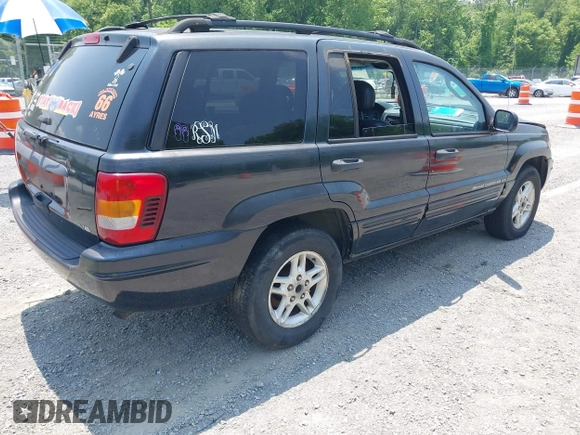 2004 Jeep Grand Cherokee with VIN 1J8GW48N94C135866, listed as a IAAI auction lot 42419888 with 326,880 mi miles and . Bid and sale history available at DreamBid. Image 4.