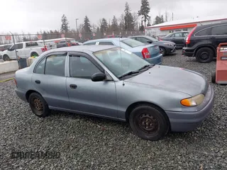 1997 Hyundai Accent z VIN KMHVF24N2VU365832, wystawiony jako IAAI lot #41549953 z przebiegiem 168 072 mil mil oraz . Historia ofert i sprzedaży dostępna na DreamBid. Obrazek 13.