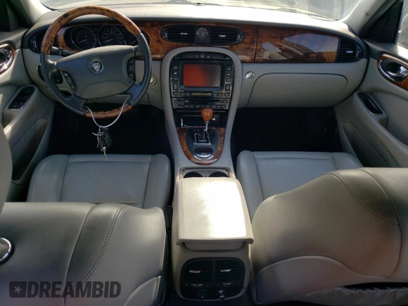 2005 Jaguar XJ with VIN SAJWA79C15SG40523, listed as a Copart auction lot 77994844 with 113,634 mi miles and Clean Title. Bid and sale history available at carsss.com. Image 8.