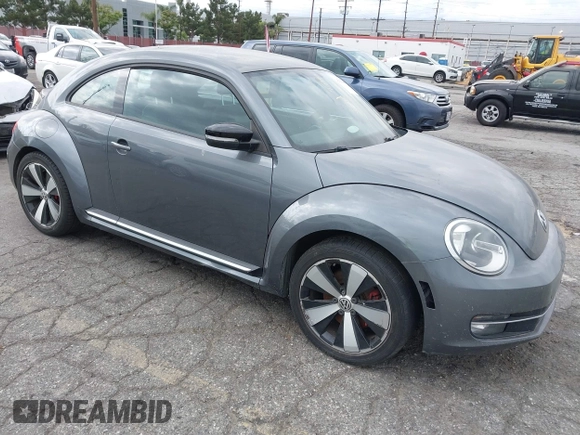 2012 Volkswagen Beetle 2.0T Turbo w/Sun/Snd/Nav PZEV with VIN 3VWVA7AT5CM653829, listed as a IAAI auction lot 42121383 with 114,474 mi miles. Bid and sale history available at carsss.com. Image 1.