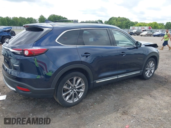 2020 Mazda CX-9 Grand Touring with VIN JM3TCBDY1L0402718, listed as a IAAI auction lot 42355511 with 87,205 mi miles and . Bid and sale history available at DreamBid. Image 4.