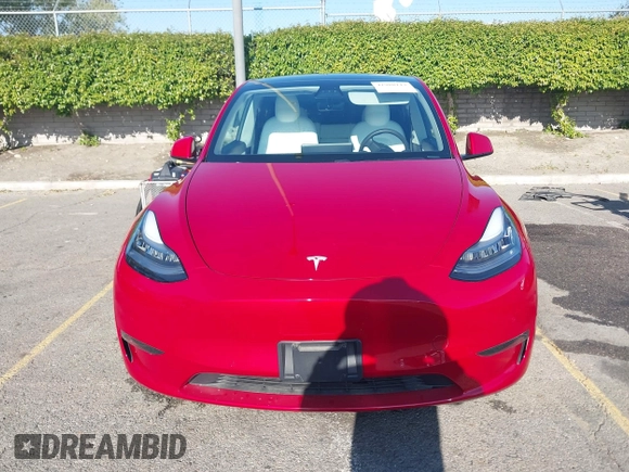 2020 Tesla Model Y Long Range with VIN 5YJYGDEE8LF057014, listed as a IAAI auction lot 41988113 with 18,246 mi miles and . Bid and sale history available at DreamBid. Image 13.
