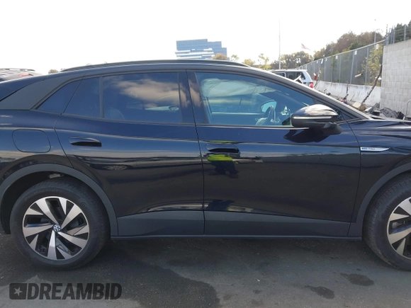 2023 Volkswagen ID.4 Pro z VIN 1V2DNPE85PC028748, wystawiony jako IAAI lot #41348983 z przebiegiem 7 434 mil mil oraz . Historia ofert i sprzedaży dostępna na DreamBid. Obrazek 13.