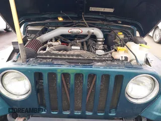 1998 Jeep Wrangler Sport with VIN 1J4FY19S7WP787679, listed as a IAAI auction lot 41764883 with 134,144 mi miles. Bid and sale history available at carsss.com. Image 10.