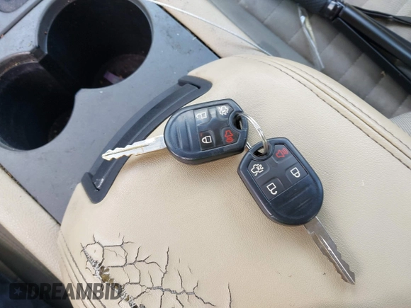 2014 Ford Taurus SE z VIN 1FAHP2D81EG140072, wystawiony jako IAAI lot #42124900 z przebiegiem 116 560 mil mil oraz . Historia ofert i sprzedaży dostępna na DreamBid. Obrazek 11.