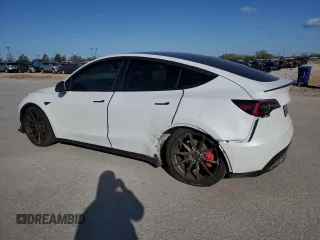 2021 Tesla Model Y Performance with VIN 5YJYGDEF3MF262878, listed as a Copart auction lot 52897595 with 50,939 mi miles and Salvage Title. Bid and sale history available at DreamBid. Image 2.