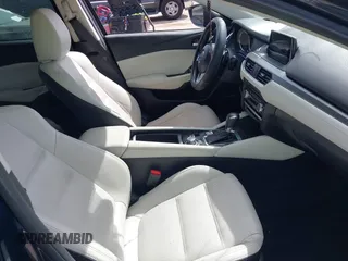 2016 Mazda 6 i Grand Touring with VIN JM1GJ1W59G1439075, listed as a IAAI auction lot 41792755 with 99,215 mi miles and . Bid and sale history available at DreamBid. Image 5.