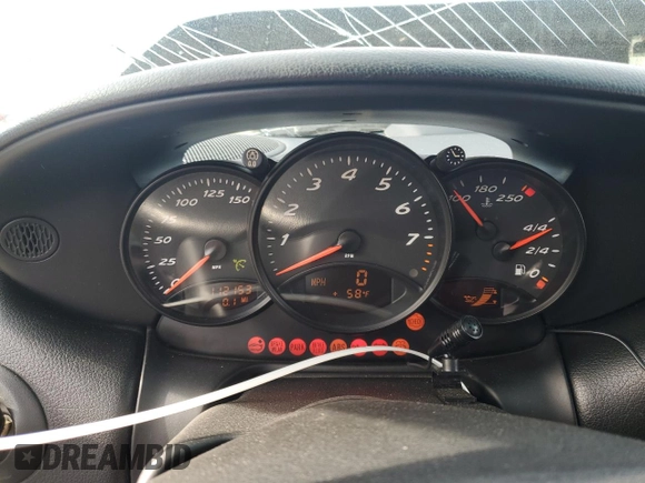 2000 Porsche Boxster z VIN WP0CA2984YU627674, wystawiony jako Copart lot #86027054 z przebiegiem 112 153 mil mil oraz Szkoda całkowita • Salvage title. Historia ofert i sprzedaży dostępna na DreamBid. Obrazek 9.