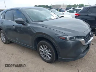 2023 Mazda CX-5 S Carbon Edition z VIN JM3KFBCM7P0226930, wystawiony jako IAAI lot #41939956 z przebiegiem 29 477 mil mil oraz . Historia ofert i sprzedaży dostępna na DreamBid. Obrazek 1.