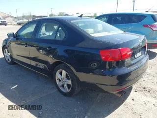2012 Volkswagen Jetta TDI w/Premium & Nav z VIN 3VWLL7AJ7CM400382, wystawiony jako IAAI lot #42274839 z przebiegiem 150 205 mil mil oraz . Historia ofert i sprzedaży dostępna na DreamBid. Obrazek 3.