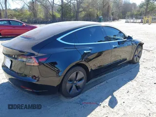 2019 Tesla Model 3 Mid Range with VIN 5YJ3E1EA2KF306286, listed as a IAAI auction lot 41699127 with 56,249 mi miles and . Bid and sale history available at DreamBid. Image 4.