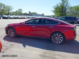 2014 Tesla Model S 60 kWh Battery with VIN 5YJSA1H1XEFP38289, listed as a IAAI auction lot 42092052 with 75,668 mi miles. Bid and sale history available at carsss.com. Image 15.