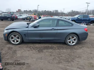 2014 BMW 4 Series 428i xDrive with VIN WBA3N9C50EK246002, listed as a IAAI auction lot 41612256 with 100,915 mi miles and . Bid and sale history available at carsss.com. Image 14.