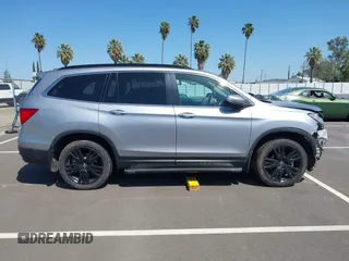 2021 Honda Pilot Special Edition with VIN 5FNYF6H27MB094704, listed as a IAAI auction lot 41953899 with 55,462 mi miles and . Bid and sale history available at DreamBid. Image 14.