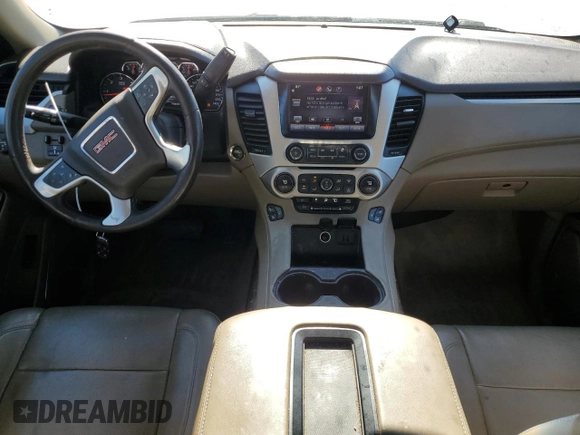 2015 GMC Yukon SLT with VIN 1GKS1BKC7FR120802, listed as a Copart auction lot 87430984 with 191,829 mi miles and Salvage Title. Bid and sale history available at carsss.com. Image 8.